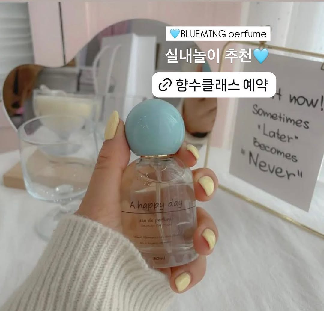 A happy day perfume with blue cap